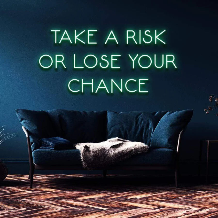 "TAKE A RISK OR LOSE YOUR CHANCE" NEON SIGN