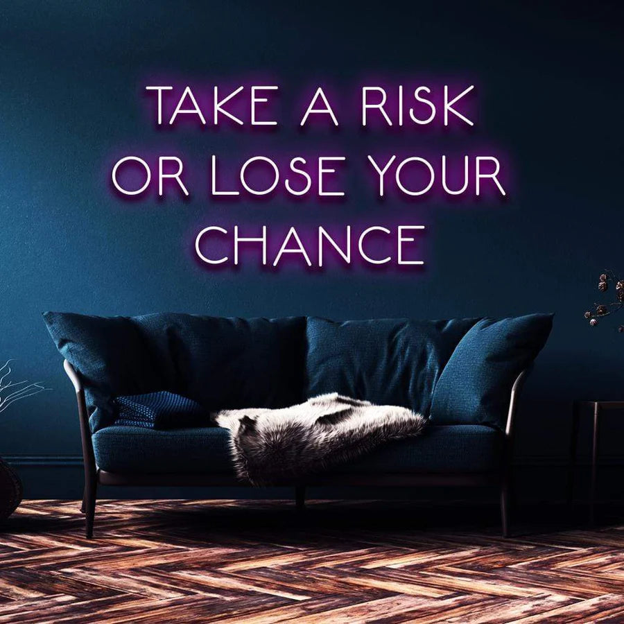 "TAKE A RISK OR LOSE YOUR CHANCE" NEON SIGN