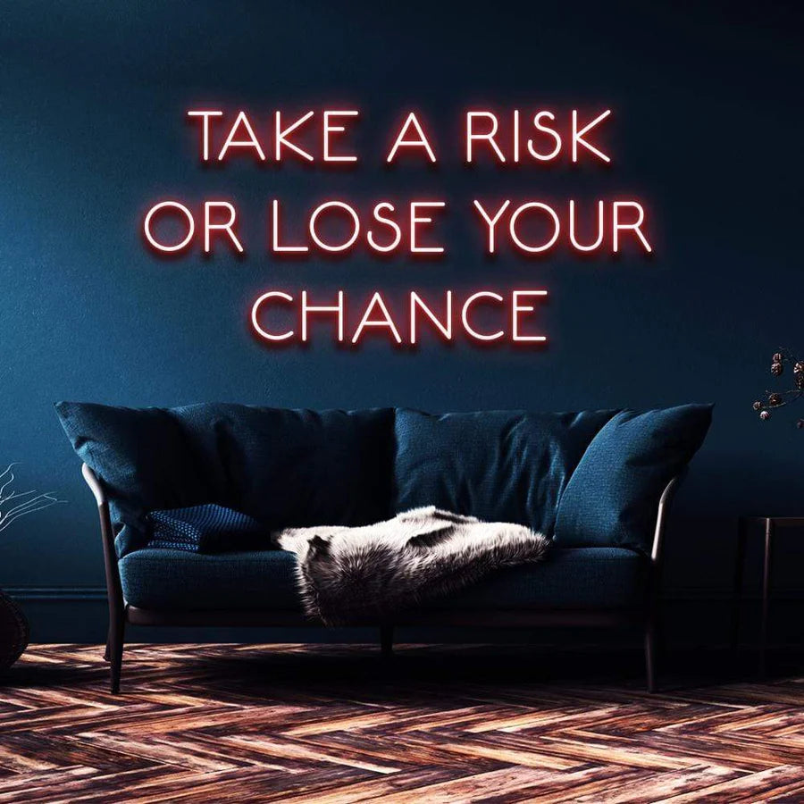 "TAKE A RISK OR LOSE YOUR CHANCE" NEON SIGN