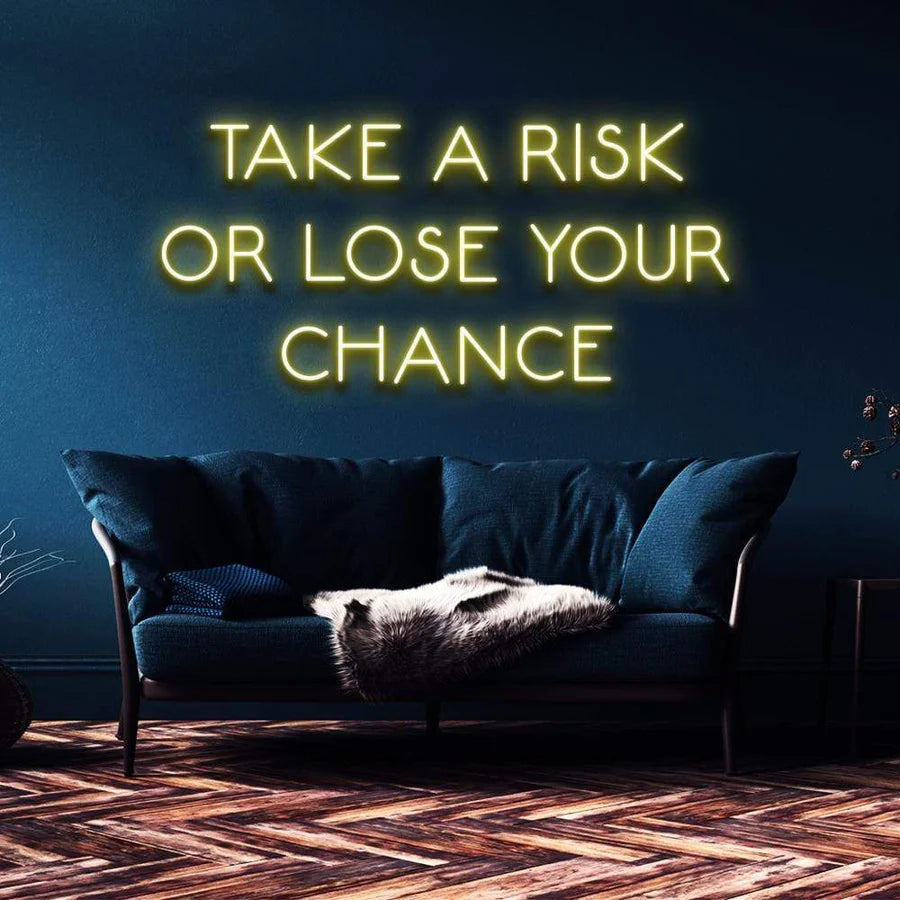 "TAKE A RISK OR LOSE YOUR CHANCE" NEON SIGN